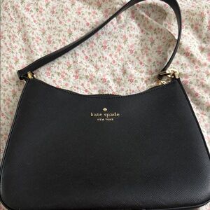 Kate Spade Classic Black Shoulder Bag comes with a long strap
